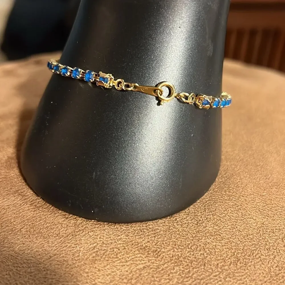 Avon faux sapphire tennis bracelet.
